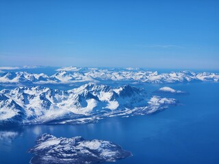 Norwegian Winter Ocean Mountain Range from plane window 