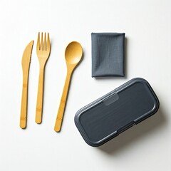 top view of flatware and food container on white background