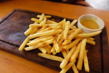 Enjoy Crispy French Fries that are Delightfully Served with a Dipping Sauce