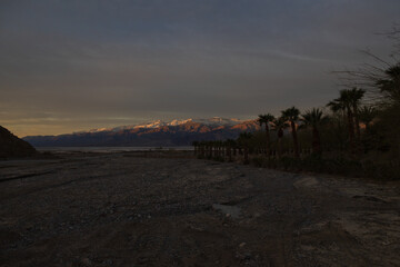 Sunset on snow covered mountain range