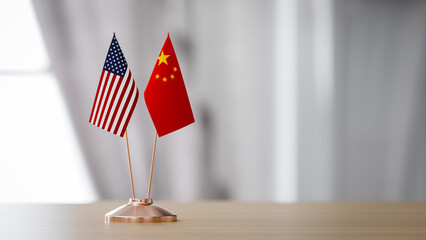 The flags of the United States and China are on the table in the conference hall.. 3d rendering