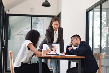 Tense office business meeting with irritated boss and his team The atmosphere was full of disappointment and they were looking for a way out of the problem.