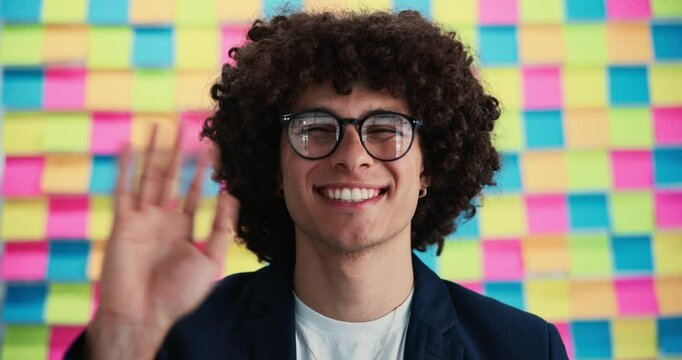 Face, business and man with wave with sticky notes as background for virtual meeting, ideas or planning. Male person, employee and happy or smile with greeting in confidence for startup company