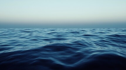 Fototapeta premium Calm ocean waves under a serene sky.