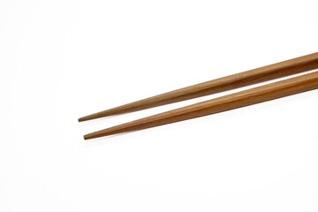 Wooden chopsticks placed on a white background
