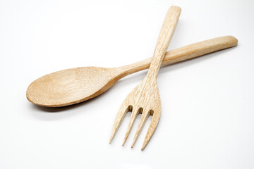 Wooden spoon and wooden fork isolated on white background