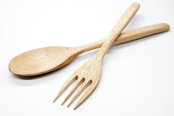 Wooden spoon and wooden fork isolated on white background