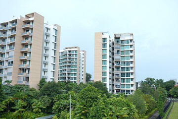 View Of Modern Buildings And Green Park Space Under Blue Sky 