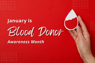 Blood donation, hand with heart and text, on bright background.