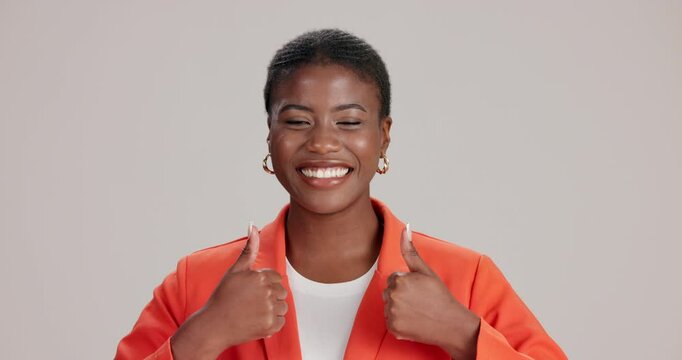 Black woman, face and thumbs up for approval in studio, feedback and emoji on white background. Female person, support winner and icon for affirmation or promotion, portrait and review great news
