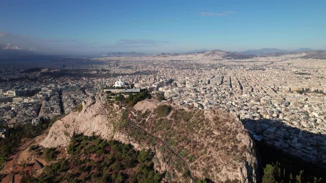 Athens, Greece drone shot with Lycabettus Hill in forground, 4K