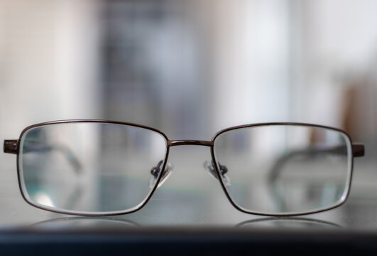 Profile view of glasses on a table .Bice soft background.