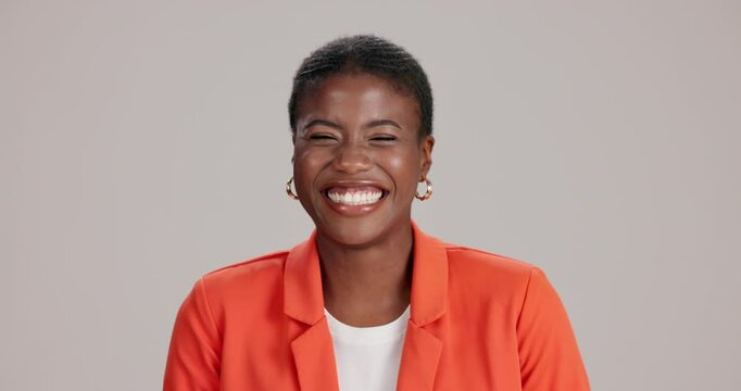 Face, laughing and black woman with smile, confidence and funny joke in studio with work style. Fashion, winking and joy with professional, silly and employee with comedy and brown background