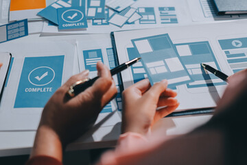 Young Asian business creative team work together, mobile application software design project. Brainstorm meeting, internet technology, smartphone web app designer, office coworker teamwork concept