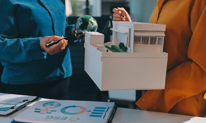 ESG environmental social governance display on laptop on eco-friendly company meeting with business people implementing environmental protection for clean and sustainable future ecology. Trailblazing