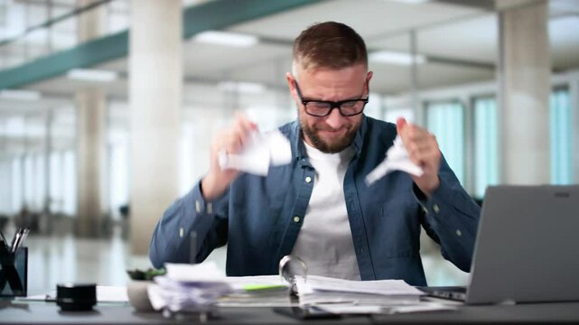 Shocked Businessman Tearing Bill Document