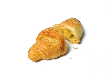 Close up view of broken in half croissants. Fresh baked butter breakfast croissants. Pastry shop or bakery card.