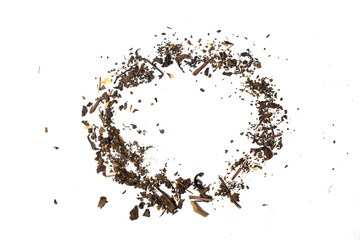 Top view of scattered dried tea leaves. circle.