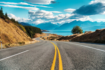 Scenic Peters lookout with winding road and Mount Cook and Lake Pukaki on sunny day in autumn at...