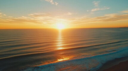 A serene sunset over calm ocean waves, reflecting warm colors.