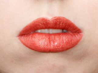 A woman's lips are painted red