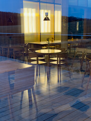 A restaurant with a lot of tables and chairs
