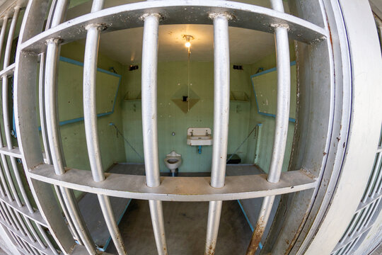 A jail cell with a toilet and sink