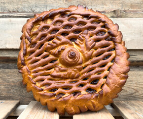 A pie with a spiral design on top