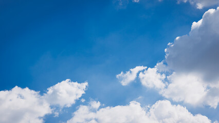 Blue and cloudy clear sky background. White fluffy cloud in nature cloudscape background.