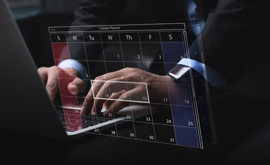 Business event planning, calendar agenda work schedule concept. Businessman using laptop computer with monthly calendar planner, workflow plan, and organize schedules. Work time management