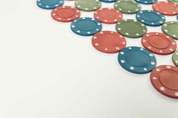Top view of poker chips on white background. Lot of gambling chips. Board game, playing cards, poker, casino. Copy space, flat lay.