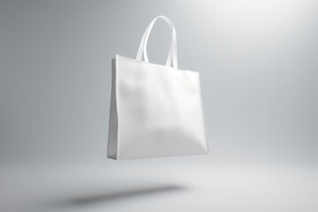 Minimalist white tote bag on gray background for branding and design