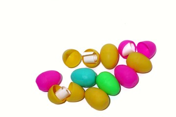 colorful egg toys with paper rolls inside. Easter surprise and prize draw concept. isolated on white background