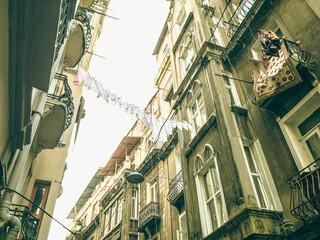 Naklejka premium YANGON, MYANMAR - MARCH 01: Unidentified people on side street, located in the centre of Downtown. 19th Street, Yangon is the main centre of the city's Chinatown Yangon has the highest number of colo