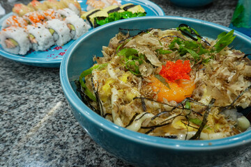 Gyudon or slice beef rice bowl and sushi on the plate. Japanese food.