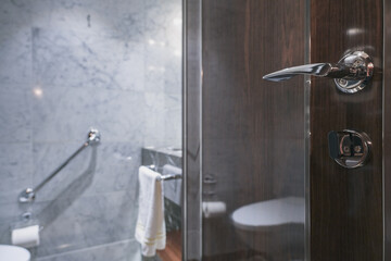 Super deluxe black and white marble bathroom of suite stateroom cabin onboard luxury ocean liner...