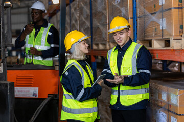 Group worker warehouse working checklist product forklift in warehouse store. Logistics factory...