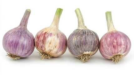 Fototapeta premium Four isolated garlic cloves on a pure white background, natural food photography concept.