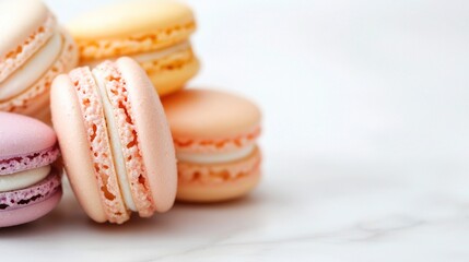Fototapeta premium Close-Up Selection of Colorful French Macarons in Pastel Shades on Marble Background