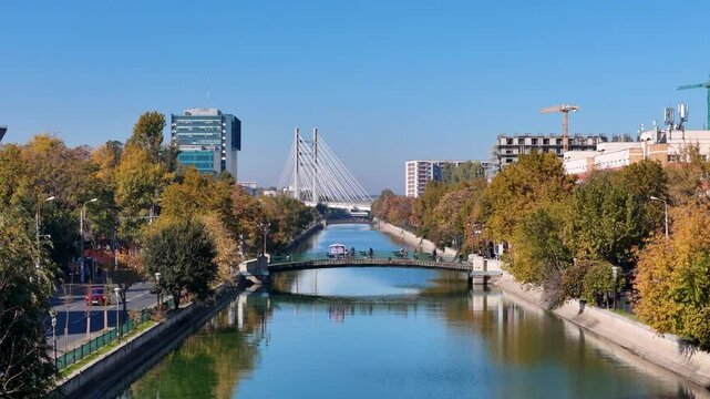Gliding Above Dambovita River in Regie Neighborhood with Ciurel Bridge in the Background, Bucharest, Romania