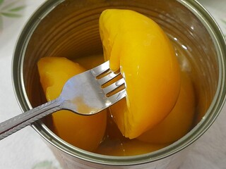 Preserved peaches in a can