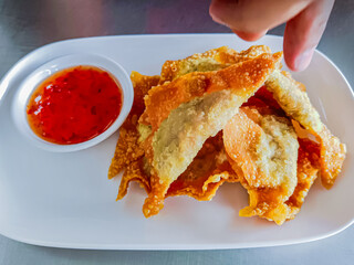 Fried dumplings with sweet sauce