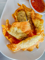 Fried dumplings with sweet sauce