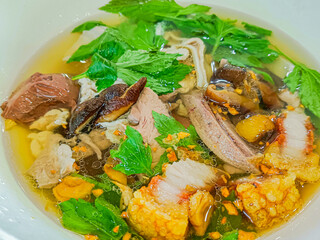 Thai style clear soup with congealed pork blood.