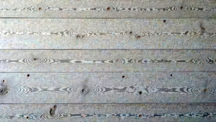 Naklejka premium Rustic wooden plank wall with natural knots and grain texture