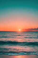 Naklejka premium Serene sunset over calm ocean waves, creating a tranquil atmosphere.