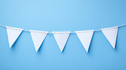 A decorative string of blank white bunting flags hanging against a bright blue background, perfect for customizable celebrations or themed events.