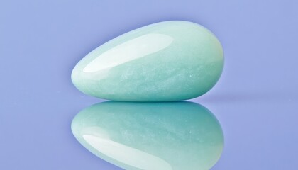 Polished Green Aventurine Stone Reflecting On Blue Surface