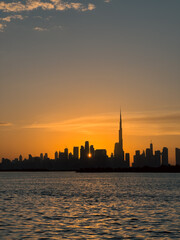 Sunset behind Dubai skyline, Cinematic Dubai cityscape stock image, Downtown Dubai, Business bay,...