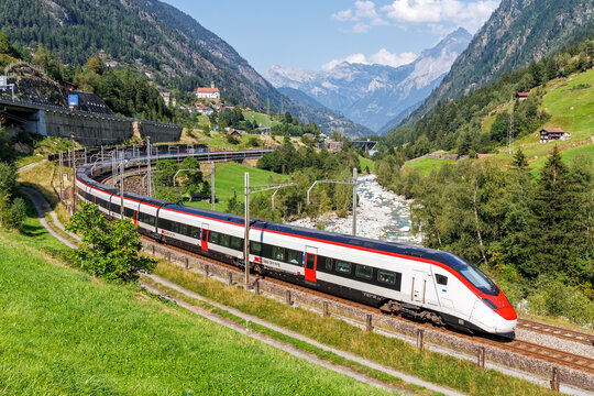Passenger train type Stadler Giruno of Schweizerische Bundesbahnen SBB on Gotthard railway in the Swiss Alps in Wassen, Switzerland